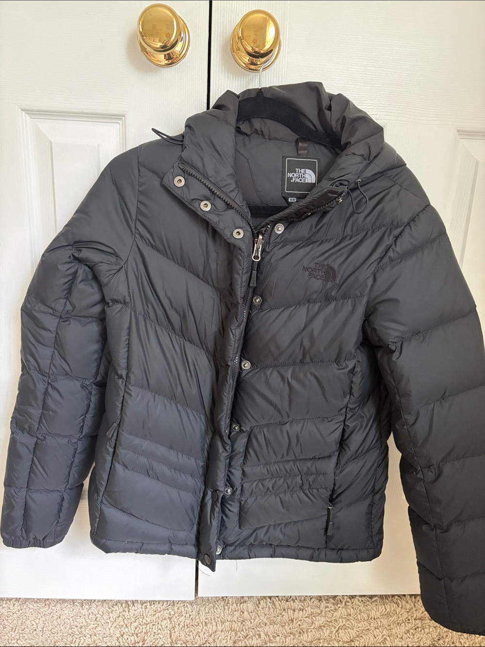 The North Face women’s Black Hooded Puffer Jacket